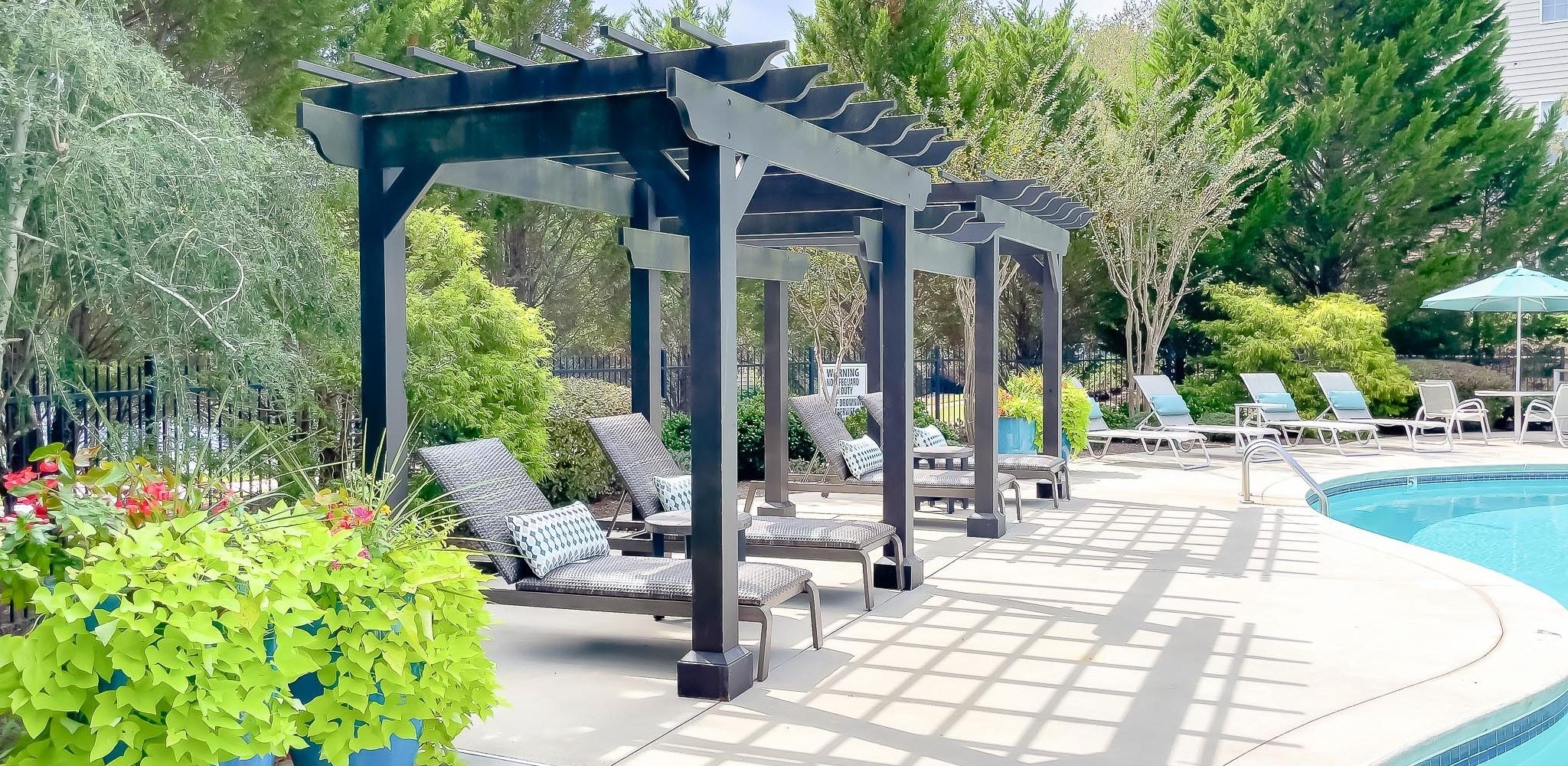 Hawthorne at Mirror Lake luxury outdoor pool with lounge chairs and surrounding seating